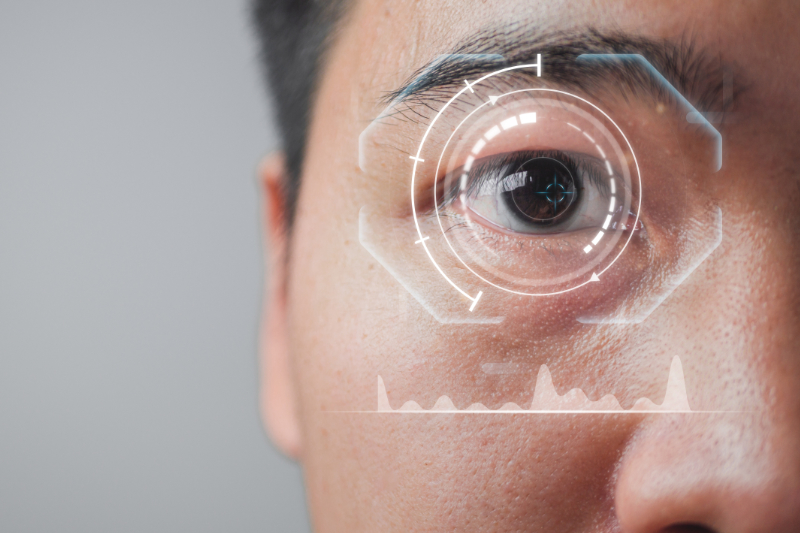 Biometric technology concept. The man uses his eye to access and